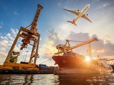 Aeroplane flying over docks